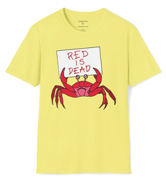 a blue t-shirt with a sad red crab holding a sign that says 'RED IS DEAD'